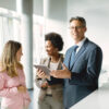 Man and two women are talking