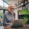 Woman at the laptop uses the calendar in onOffice enterprise