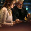 Woman and man use onOffice enterprise on their laptop