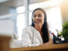 Woman with headset uses onOffice property management