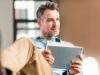 Man with tablet takes part in onOffice training